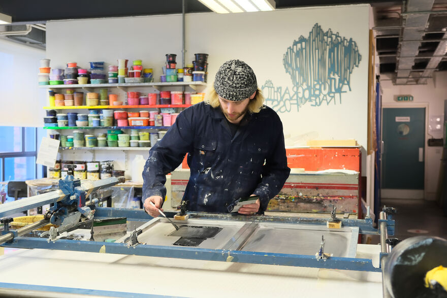 Dominic McKeown screen printing in DCA Print Studio