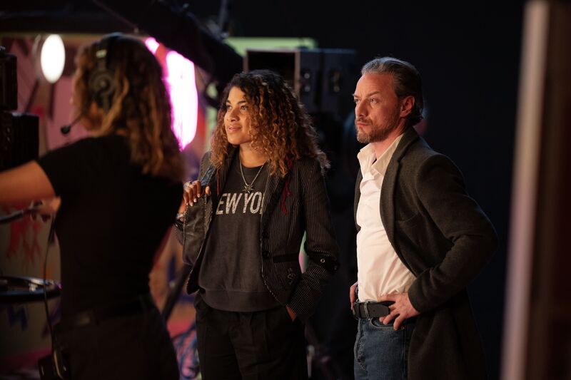 James McAvoy in a suit watching a stage performance