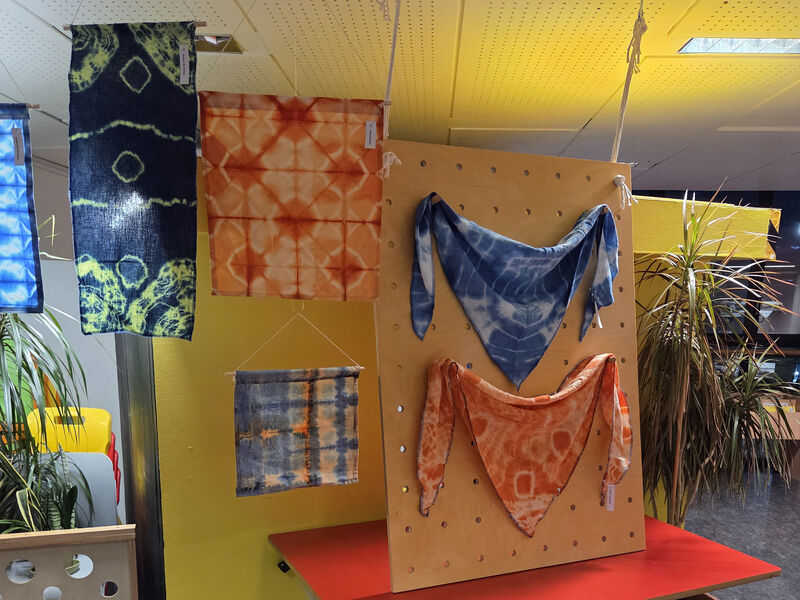 Printed Shibori fabrics hanging up in Create Space