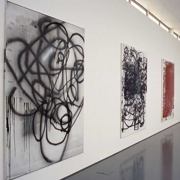 From Christopher Wool's exhibition at DCA Galleries. Abstract compositions are made up of black and red spray paint and paint.