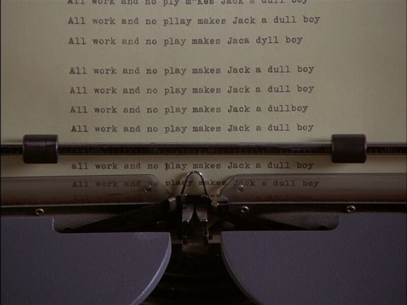 Typewriter with typed page reading: All work and no play makes Jake a dull boy, repeated over and over