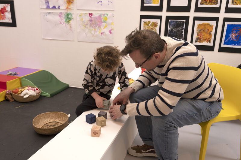 Parent and child playing with blocks in Spring Holiday Pop-up