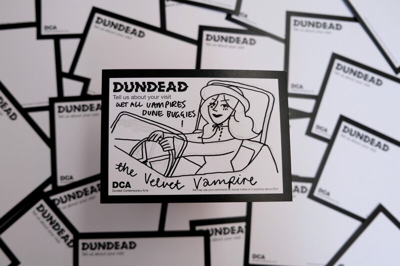 Dundead comment card for The Velvet Vampire with drawing of a woman in a car with text: Get all vampires dude buggies! 