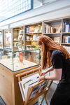 Person looking in the print browsers in DCA Shop