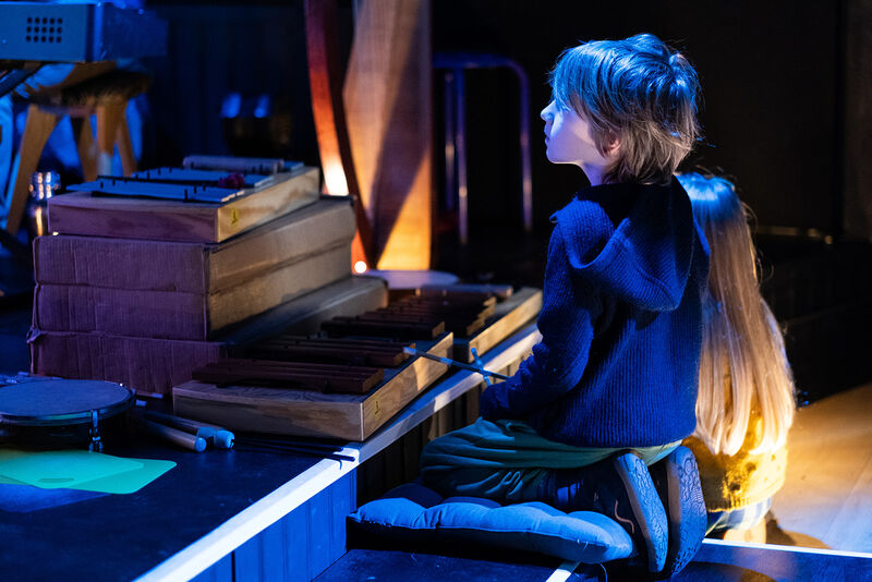 A boy and girl with instruments at The Enchanted Cinema