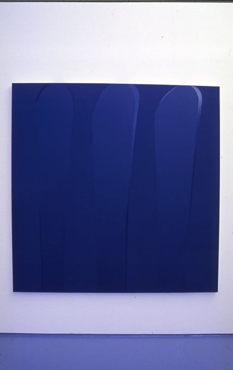 A navy rectangular painting by Ian Davenport. It has some large, soft brushstrokes in a slightly lighter colour on it too.