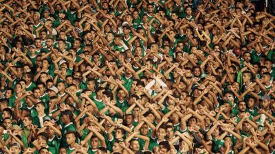 Stadium crowd with crossed arms