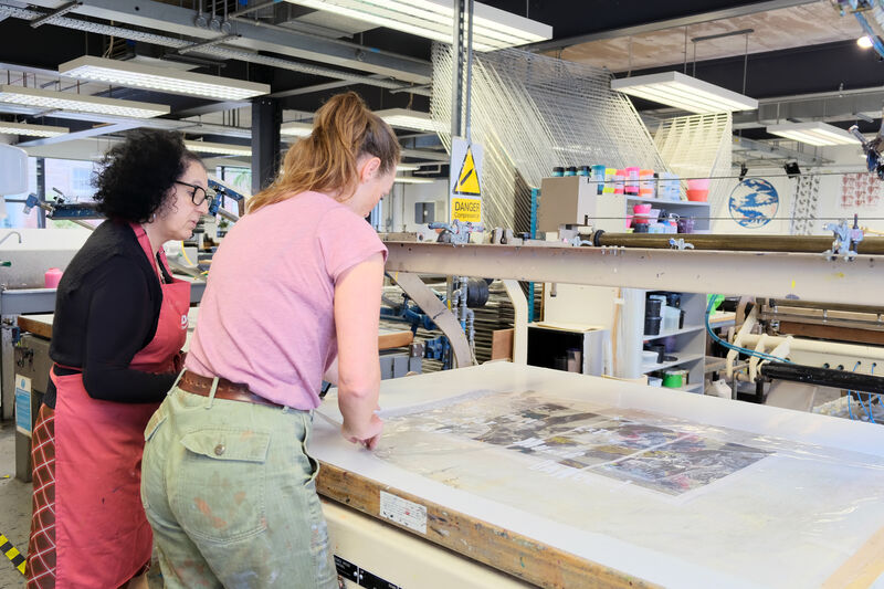 Zineb working with Print Studio Coordinator to create a screenprint