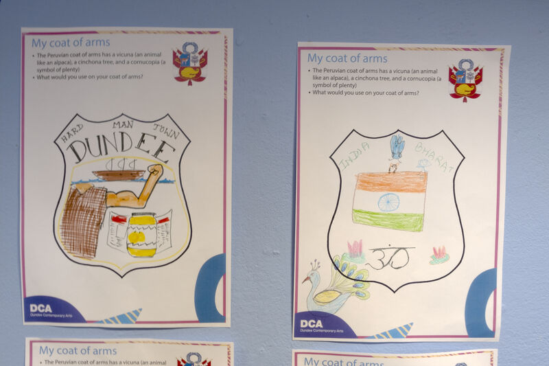 Two complete My Coat of Arms activity sheets on the wall of Create Space