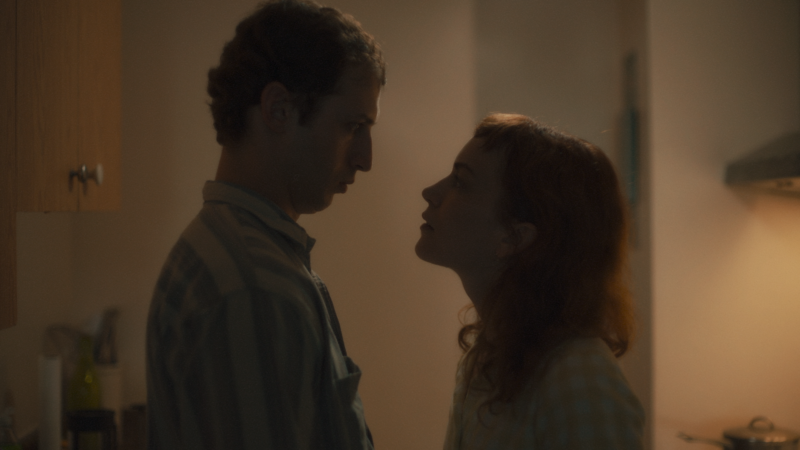 Man and woman standing looking at each other