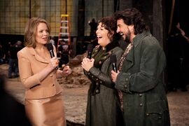 Renee Fleming interviews two opera singers on stage.