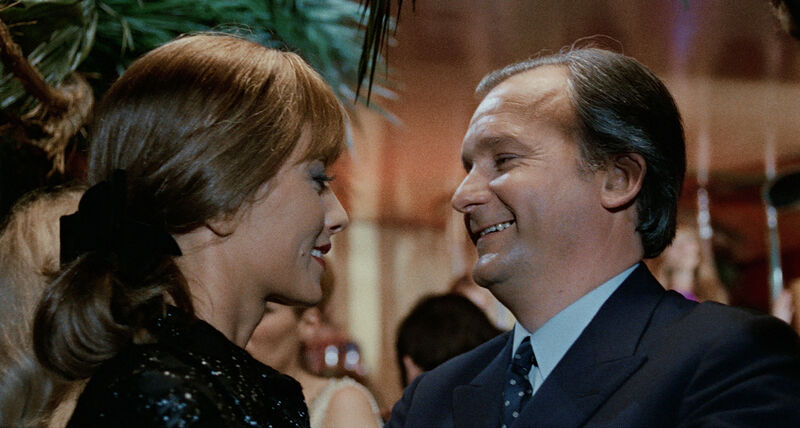 A woman and a man laugh