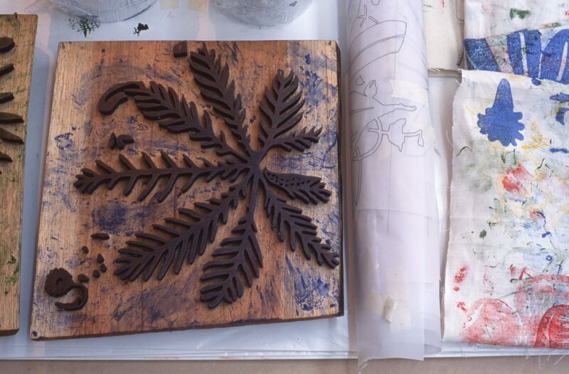 A wood print of a leaf.