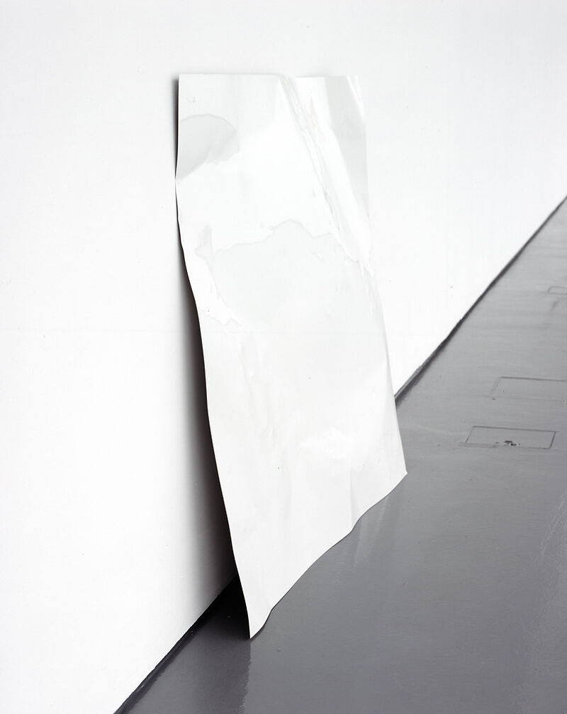From Camilla Løw's exhibition. A crumpled white sheet lays against DCA Gallery walls.