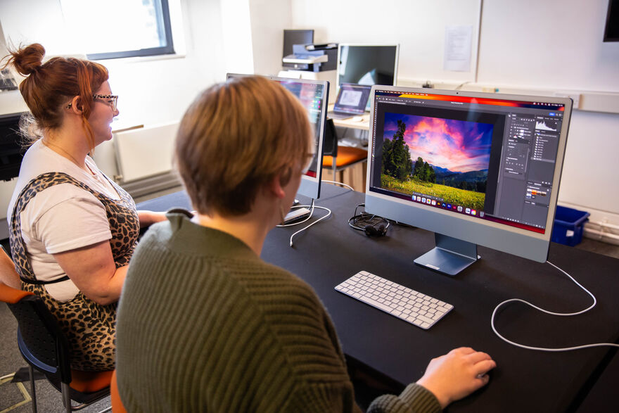 Person working on Photoshop using a Mac