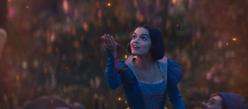 Snow White smiles and looks up at the sky.