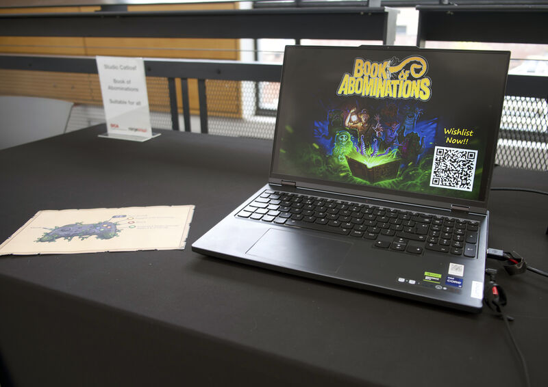 A laptop with a game on it at Drop in and Play