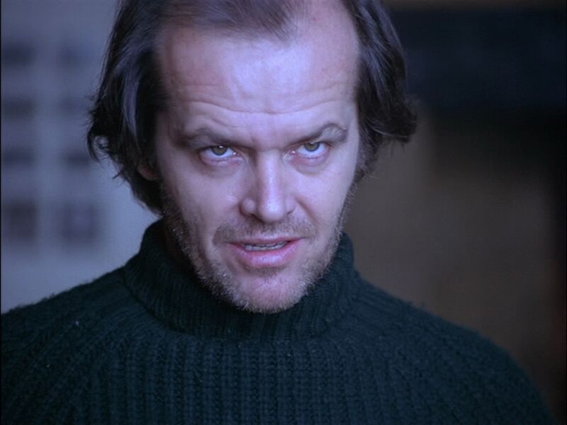 jack nicholson looking menacing in a dark poloneck jumper
