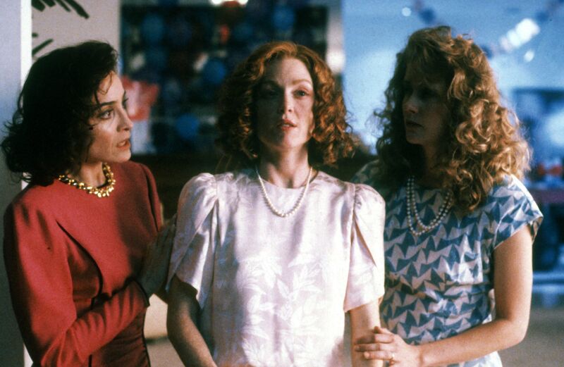 Three women with curly 80s style hair