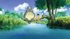 A still from the animation My Neighbour Totoro shows Totoro, a large, round, grey fluffy creature sitting on a tree branch over a lake with two small children who are fishing.