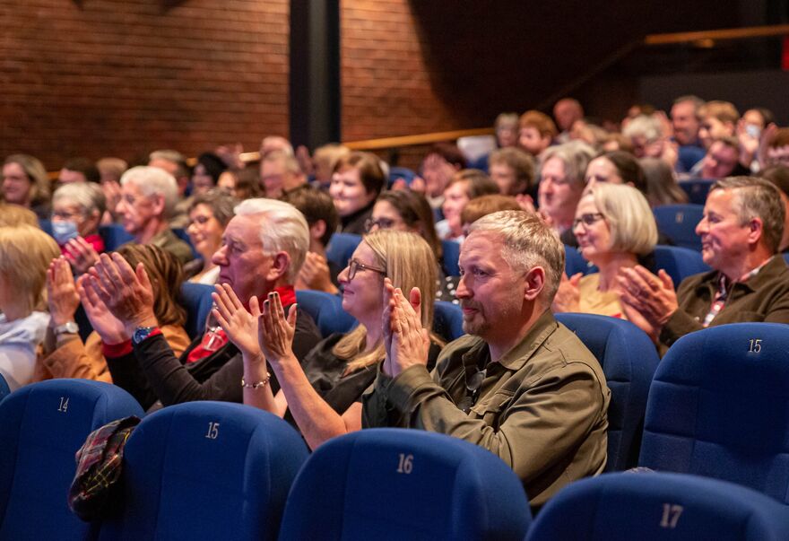 Audience applauding in a cinema at DCA