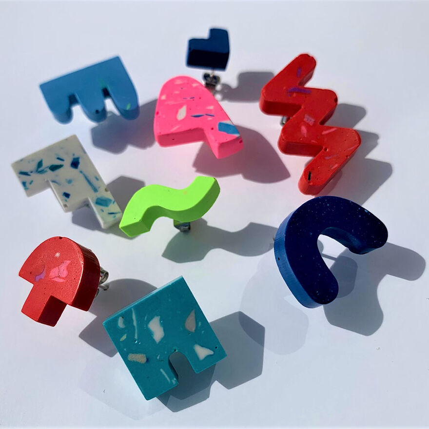 Selection of different coloured and shaped jesmonite earrings by Syrah Jay