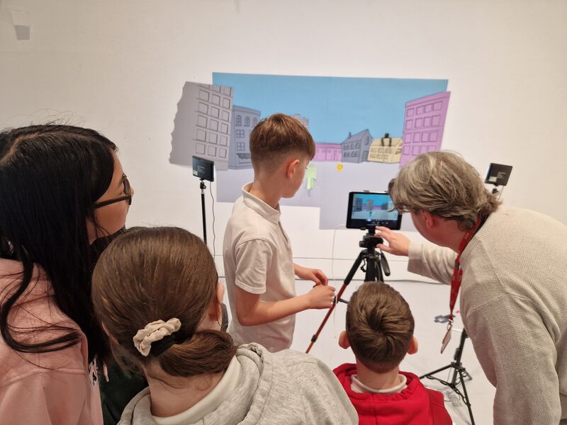 Children creating a stop motion animation a member of DCA's Learning team