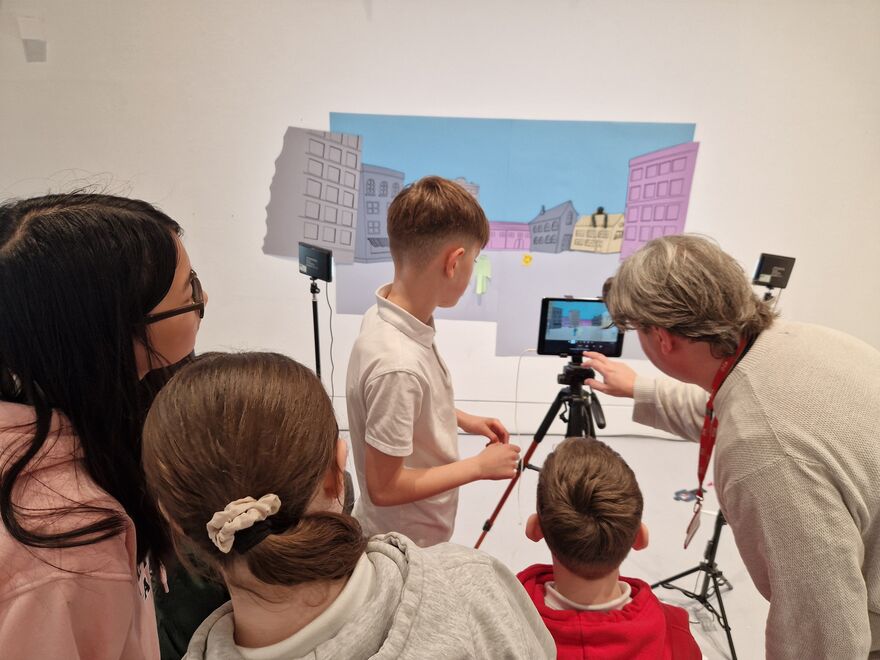 Children creating a stop motion animation a member of DCA's Learning team