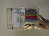 A small kit with weaving tools and fabric in it