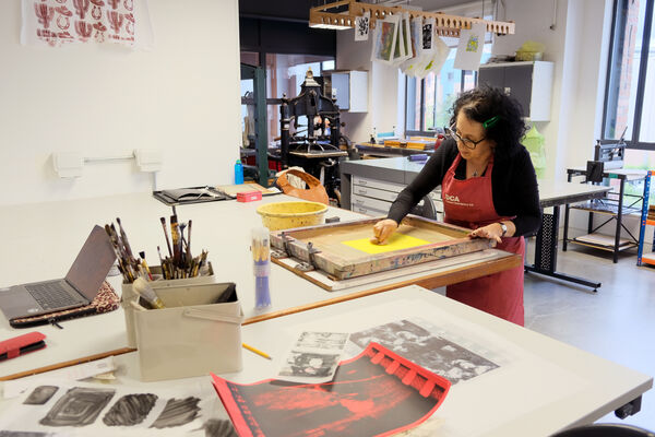 Zineb Sedira working on a silk screen in DCA Print Studio