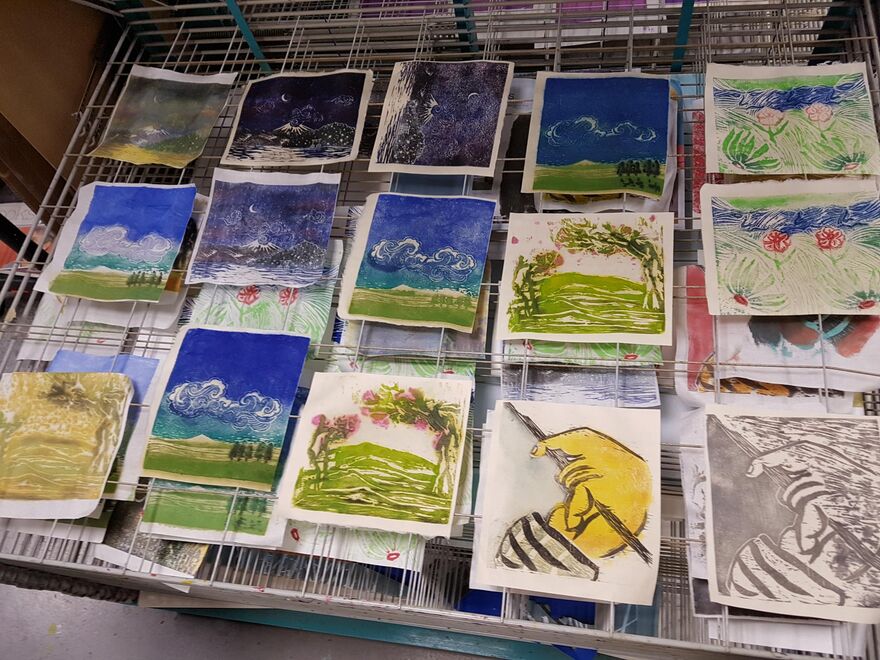 Japanese woodbloack prints drying on a rack
