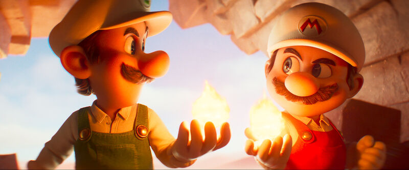 Mario and Luigi hold flames and smile together in a still from the Super Mario Galaxy Movie