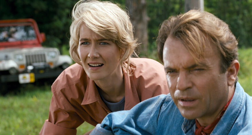 Laura Dern and Sam Neill look awestruck in Jurassic Park