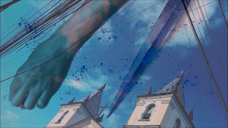 A blue image with buildings at the bottom and an arm across the picture everything is a bit surreal