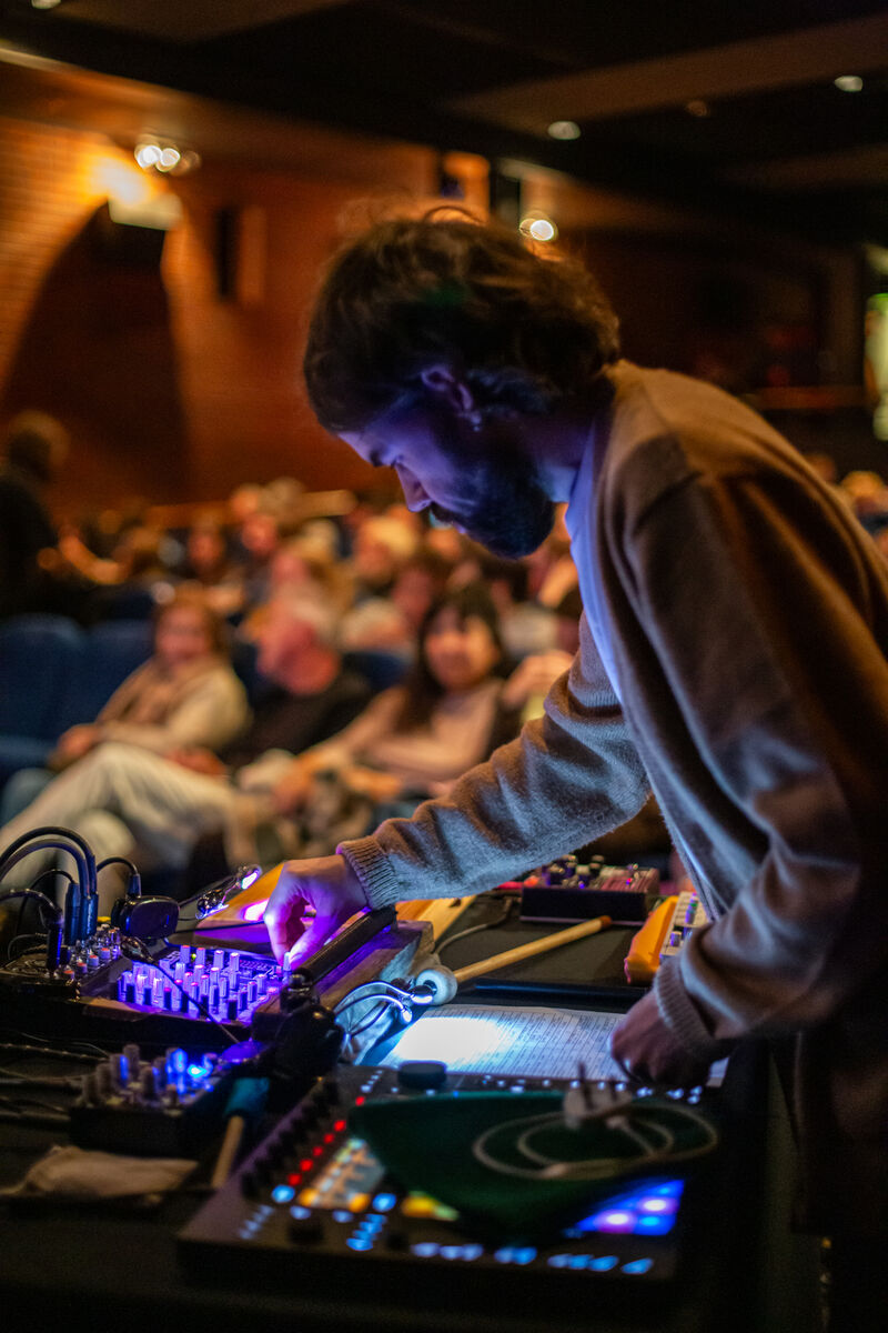 Andrew Wasylyk setting up equipment for The Phantom of the Opera as part of Dundead Halloween 2025