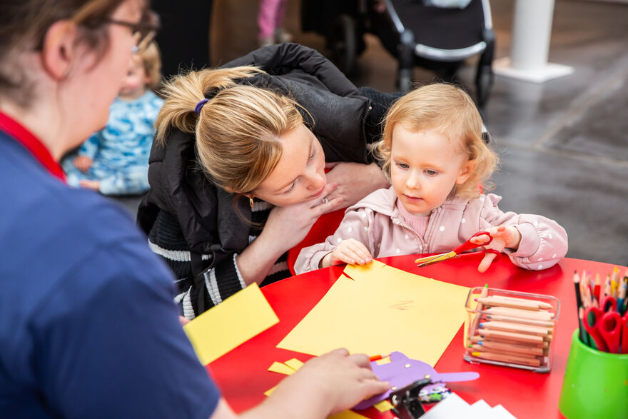Adult and child making together
