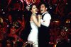 Nicole Kidman and Ewan McGregor sing on a cabaret stage.