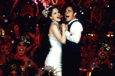 Nicole Kidman and Ewan McGregor sing on a cabaret stage.
