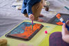 Child painting with a paintbrush