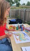 DCA Learning artist tutor creating an artwork with a squeegee
