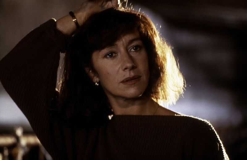 A woman with dark hair and a dark jumper.