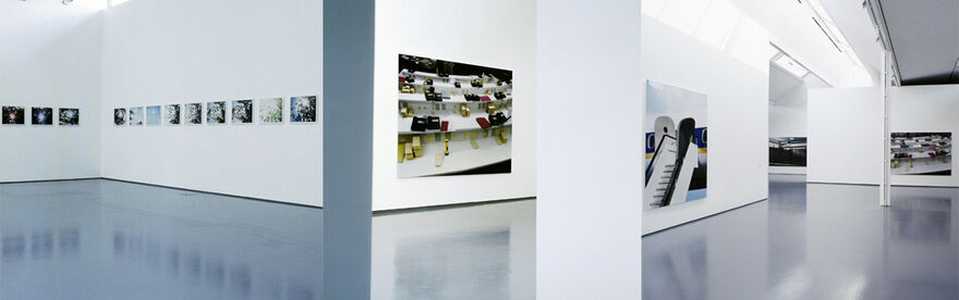 Thomas Demand's exhibition in DCA Galleries. Abstract photographs of buildings hang on the white gallery walls.