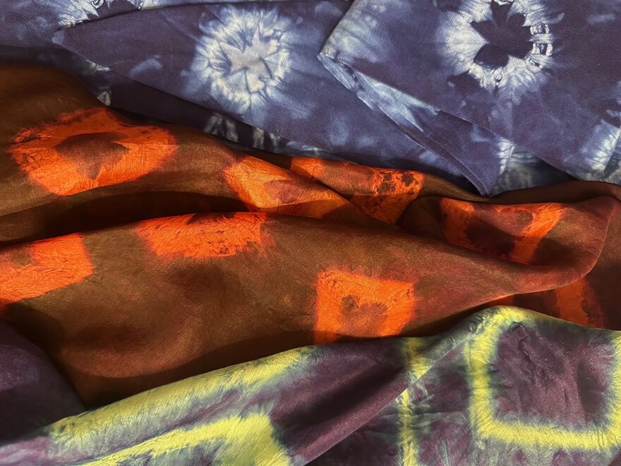 Selection of silk scarves in different colours, decorated using the Shibori dyeing technique