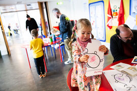Familiesdoing activity sheets in Create Space