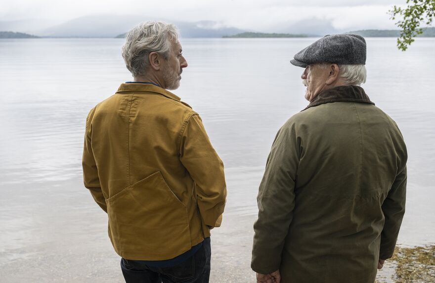 Alan Cumming and Brian Cox on the shores of a loch in Glenrothan