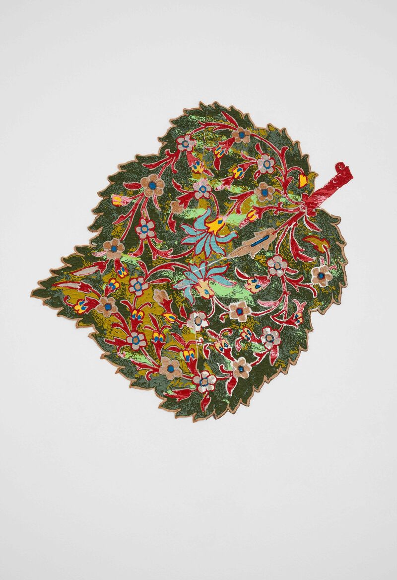 An intricate image of a leaf created by Sukaina Kubba. It has red vines and flowers on it.
