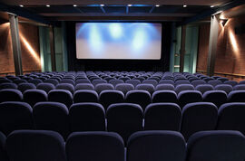 Cinema 1 at DCA with blue seats and spotlights
