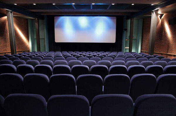 Cinema 1 at DCA with blue seats and spotlights