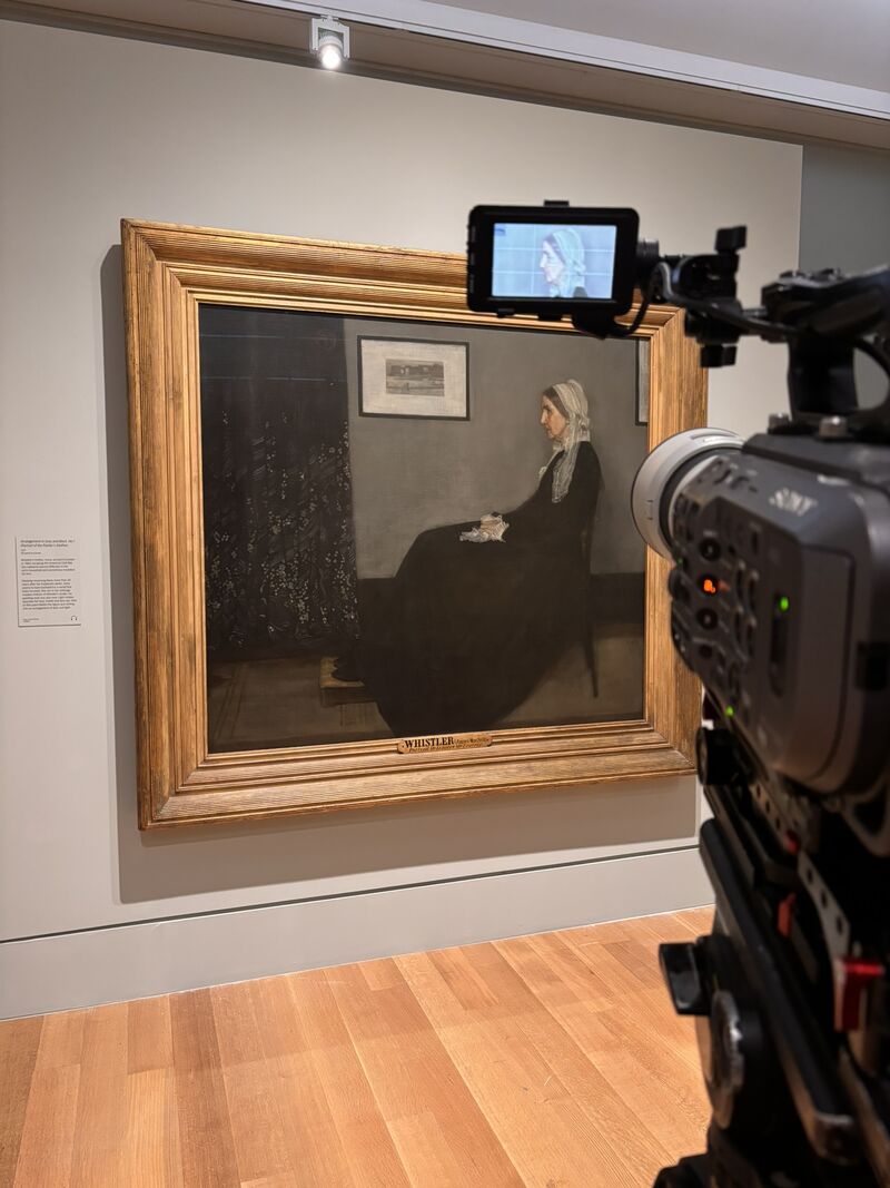A camera points at the Whistler's Mother painting