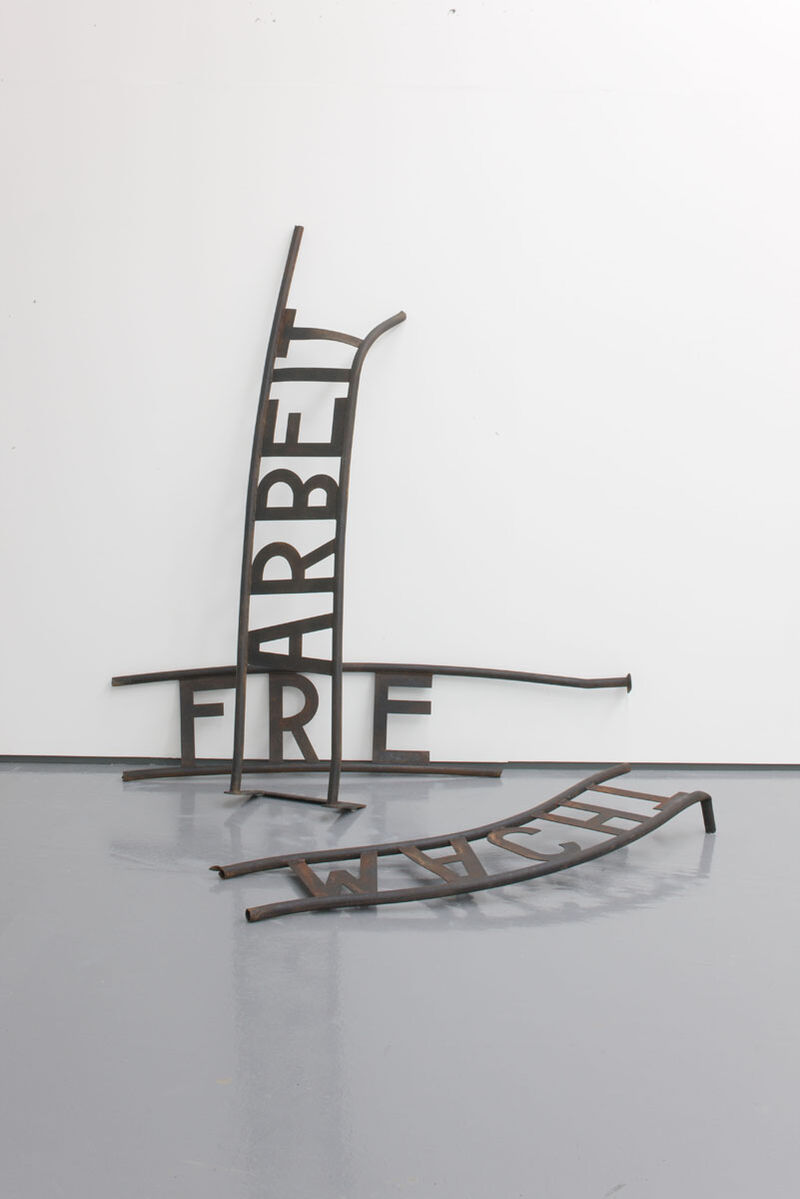 From Jonathan Horowitz's exhibition. An 'Arbeit Macht Frei' sign has been split into 3 pieces and lies on the floor of DCA Galleries.